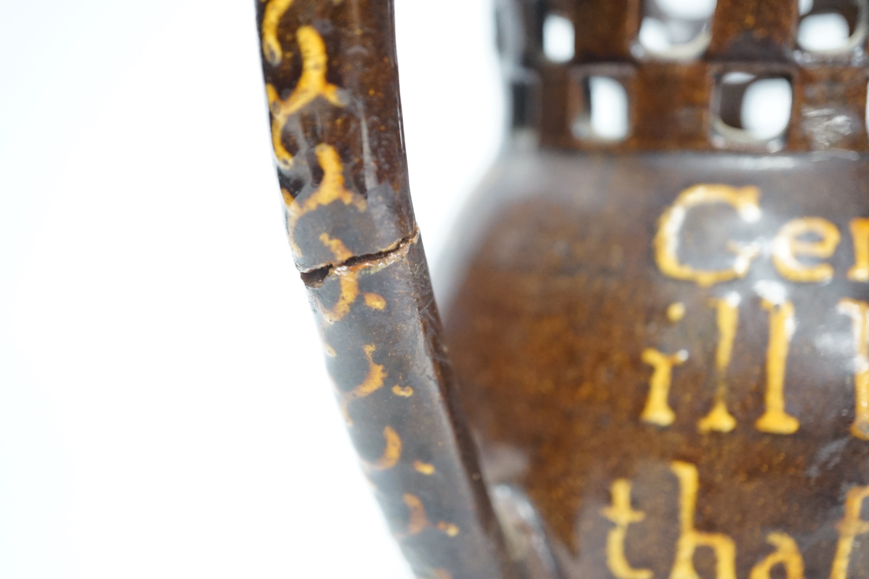 A 19th century slipware puzzle jug, 19cm